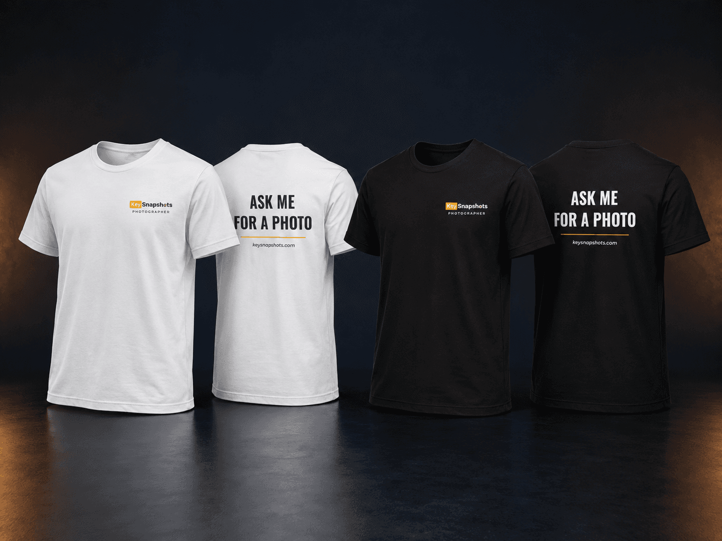 Camisetas KeySnapshots Ask Me for a Photo claras y oscuras mostrando diseños frontal y posterior